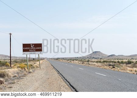 Karoo Highland Route Sign On Road R63 Between Victoria West And Loxton. A Typical Karroo Hill And An