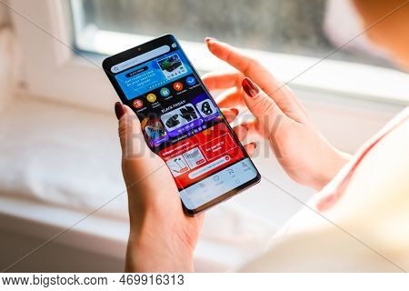 Kyiv, Ukraine - November 26, 2019: Woman Holding Phone With Internet Shopping Service Aliexpress On 