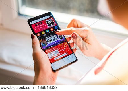 Kyiv, Ukraine - November 26, 2019: Woman Holding Phone With Internet Shopping Service Aliexpress On 
