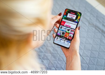 Kyiv, Ukraine - November 26, 2019: Woman Holding Phone With Internet Shopping Service Aliexpress On 