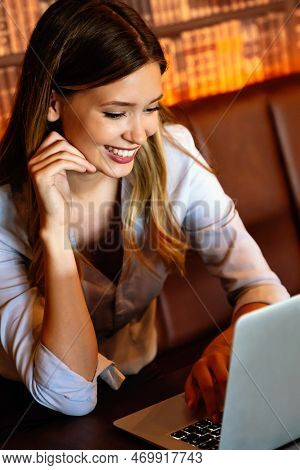 Successful Business Female Grapic Designer Using Laptop Computer During Working Process In Office