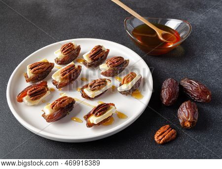 Snack Set (starters, Appetizers) With Dates, Brie Or Camambert Cheese, Pecan Nuts And Natural Organi