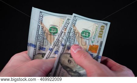 Businessman Counting Us Dollar Bill Or Paying In Cash On Money Black Background Close-up. Hands Coun