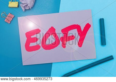Hand Writing Sign Eofy. Word Written On A Mega Sale Held On An End Of A Financial Year