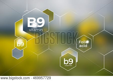 Molecular Model Of Vitamin B9. Hexagons With Vitamin B9 Name, Blurry Background.