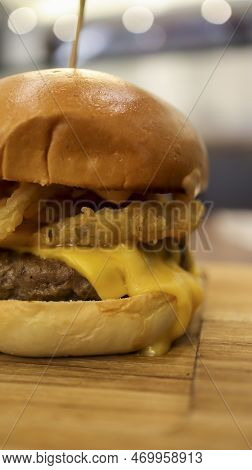 Beef Brisket Burger Which Contain Bearnaise Sauce, Tomato, Relish, Onion Rings And Mozzarella Cheese