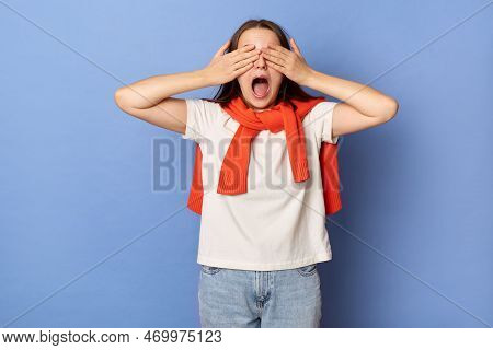 Image Of Shocked Astonished Surprised Female With Brown Hair Wearing White T-shirt And Orange Jumper