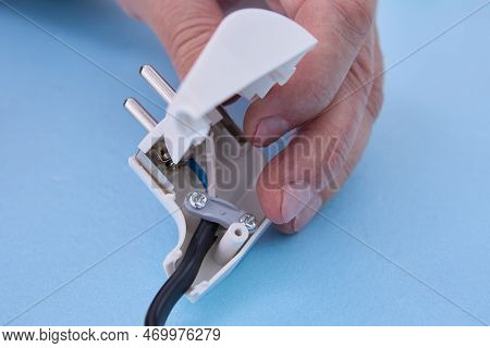 Installation Of Sectional European Electric Plug On An Electrical Cord.