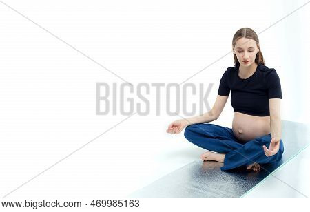 Pleasant Pregnant Woman Posing In Profile And Trying Yoga Young Happy Expectant Relaxing, Thinking A