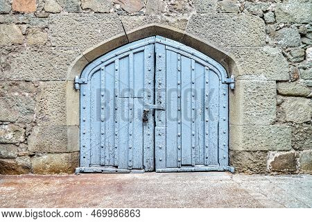 Blue Wooden Gate On Wall Surrounded By Stones In Medieval Design Hide Mysterious Things From Arrivin