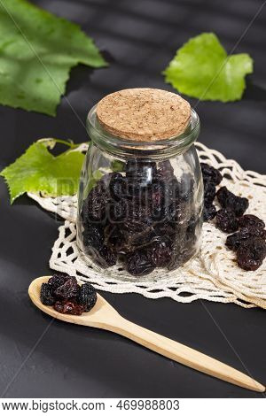 Healthy Food - Nuts Dehydrated Grapes; Photo On Dark Background