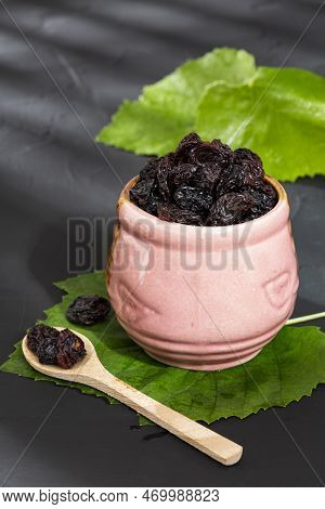 Healthy Food - Nuts Dehydrated Grapes; Photo On Dark Background