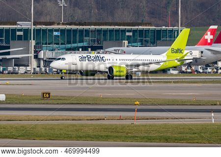 Zurich, Switzerland, January 20, 2023 Air Baltic Bombardier Cs-300 Or A220 Aircraft Takeoff From Run