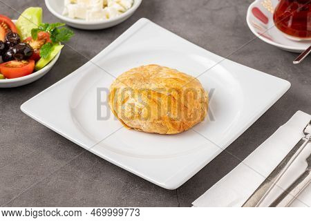 Izmir Boyoz On A White Porcelain Plate On A Stone Table