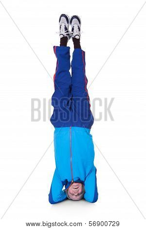Senior Man Performing Yoga Headstand