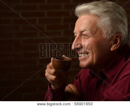 Man with cap of coffee