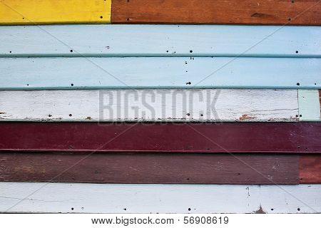 A multicolored wooden wall as a background