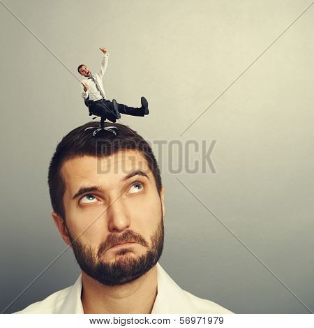 small laughing man rolling on the big head