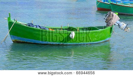 Typical fishing rowboats called gozzo in little port
