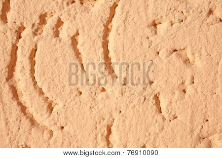 Closeup Bacgrkound Texture Of An Light Orange Plaster