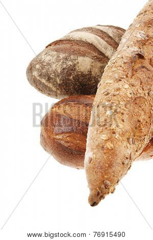 different rye and white flour bread loaf with french baguette isolated on white background