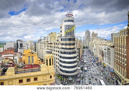 MADRID, SPAIN - OCTOBER 15, 2014: Gran Via at the Iconic Schweppes Building. The street is the main shopping district of Madrid.