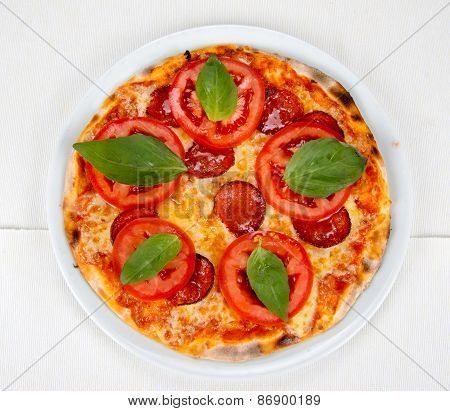 pizza with bacon, cheese and tomato