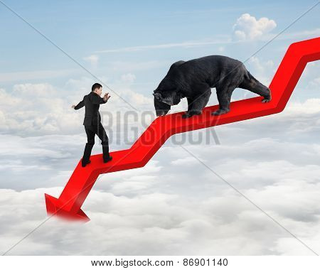 Businessman Against Bear On Arrow Downward Trend Line With Sky