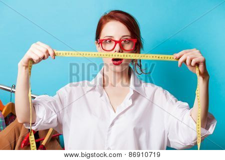 Surprised Young Redhead Designer With Metric