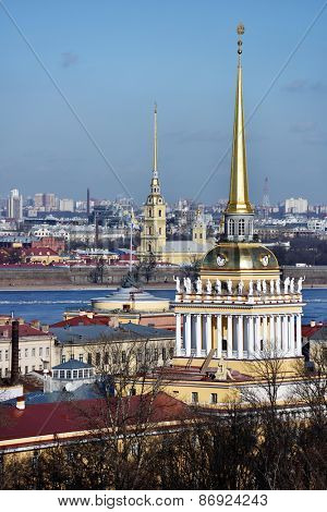 ST. PETERSBURG, RUSSIA - MARCH 5, 2015: Cityscape viewed from the St. Isaac's Cathedral with the spire of Admiralty and the spire of the Peter and Paul Cathedral. It is two most famous spires of city