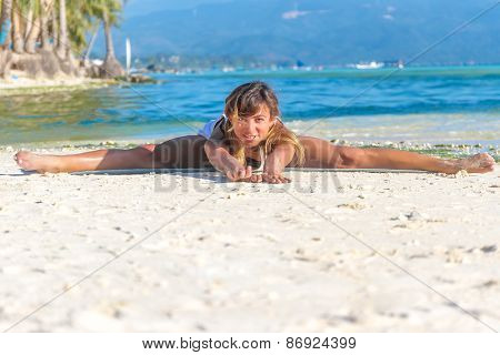 young beautiful happy smiling woman doing bodyflex, fitness, sport workout outdoors on natural background