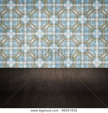 Wood Table Top And Blur Vintage Ceramic Tile Pattern Wall
