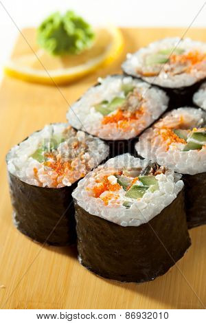 Japanese Cuisine - Sushi Roll with Eel, Cucumber and Masago inside. Nori outside