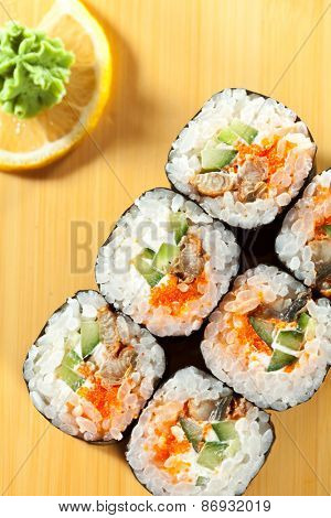 Japanese Cuisine - Sushi Roll with Eel, Cucumber and Masago inside. Nori outside