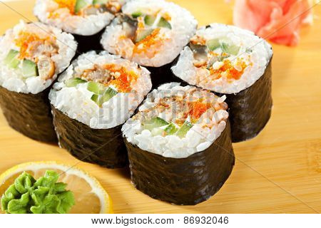 Japanese Cuisine - Sushi Roll with Eel, Cucumber and Masago inside. Nori outside