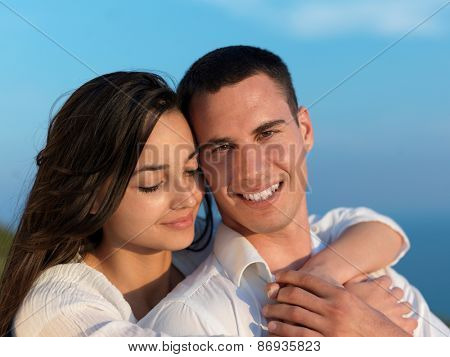 happy young romantic couple have fun relax smile at modern home outdoor terace balcony terace