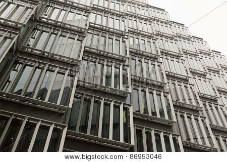 A detail of a facade cladding looking up in the sky