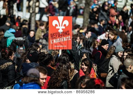Crowd With Placard, Flags And Signs Walking In The Streets