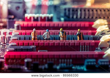 Miniature Engineers Repairing Circuit Board. Technology Concept
