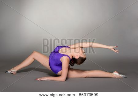 Young Female Contortionist, On Dark Background