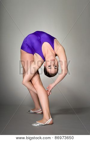 Young Female Contortionist, On Dark Background