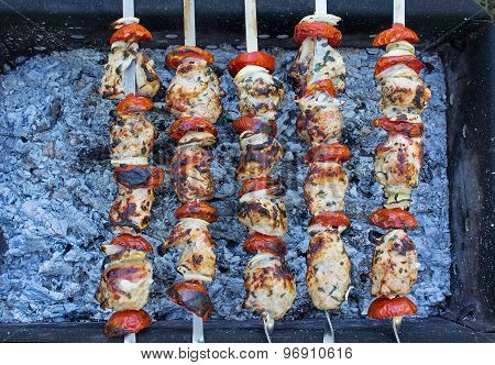 Meat On Skewers In The Process Of Preparing. Top View