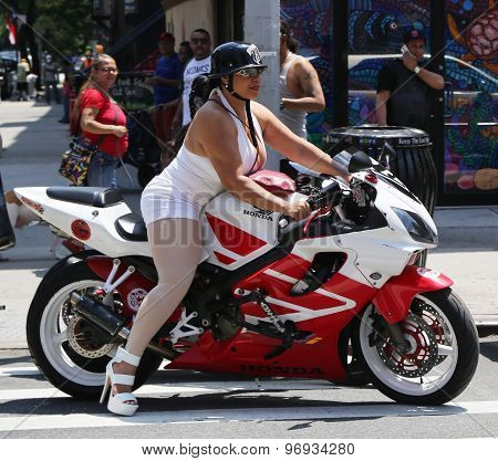 Biker girl on a motorcycle at East Harlem in New York