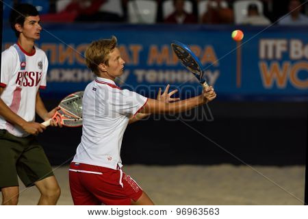 MOSCOW, RUSSIA - JULY 19, 2015: Daria Churakova (center) and Nikita Burmakin of Russia in the final match of the Beach Tennis World Team Championship against Italy. Italy become world champion