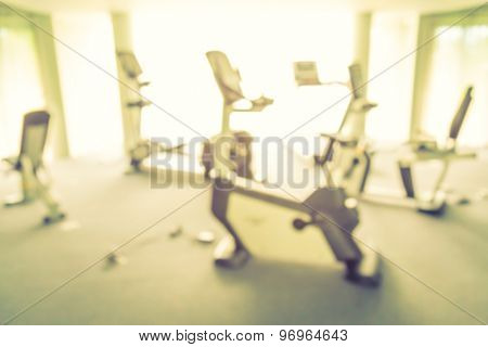Abstract blur Fitness center with traineger equipments  ( Filtered image processed vintage effect. )