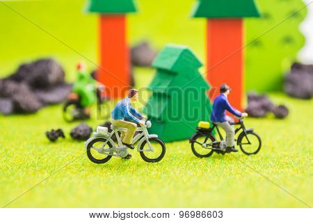 Image Group Of People(mini Figure) With Retro Bicycle In A Park - Outdoor Portrait