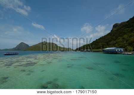 Beautiful tropical Bohey Dulang island with beach and blue water for relax