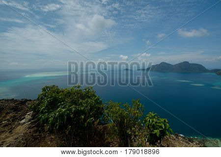 Beautiful tropical Bohey Dulang island with beach and blue water for relax