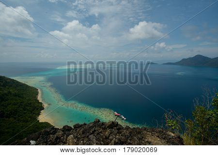 Beautiful tropical Bohey Dulang island with beach and blue water for relax