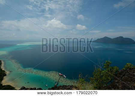 Beautiful tropical Bohey Dulang island with beach and blue water for relax